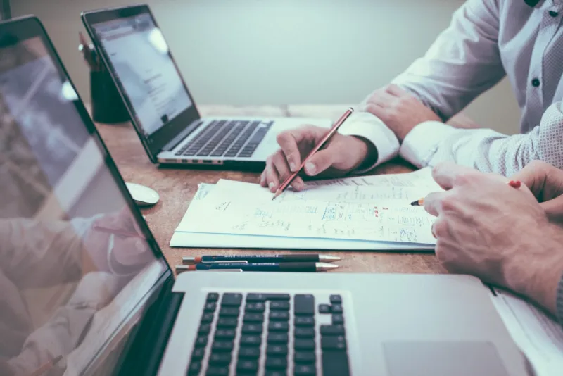 Travel planners mapping out an itinerary at a desk