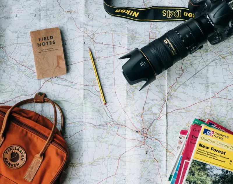 Two travellers planning a trip together with a map